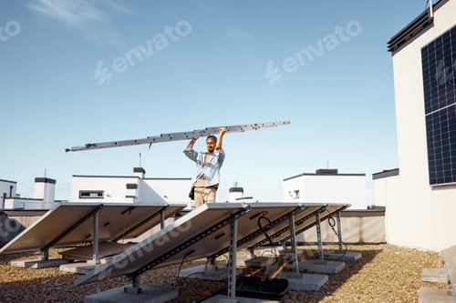 Preview: Man carries ladder during solar panels installation