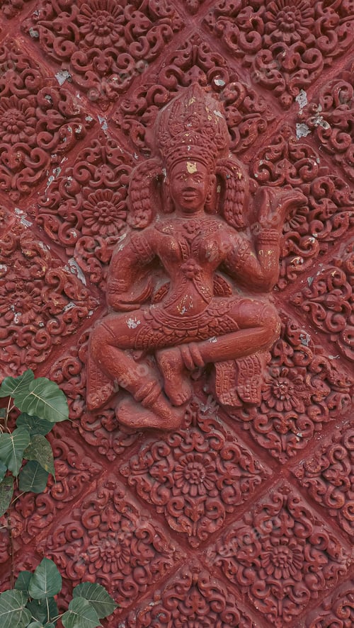 Preview: Wall sculpture of an Apsara, a spirit from Hindu and Buddhist mythology, in a Cambodian setting