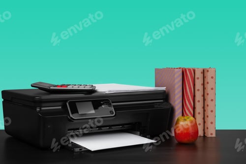 Preview: Home laser printer on desk against green background