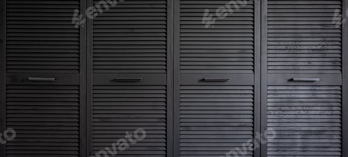 Preview: Close-up of a textured wooden black cabinet.