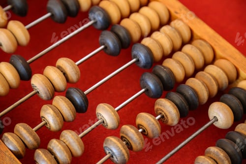 Preview: Closeup shot of old retro abacus on red background