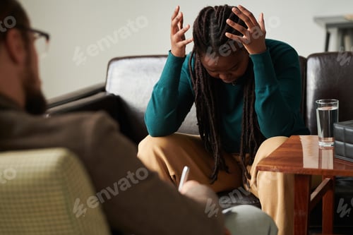 Preview: Patient expressing her anger sitting at psychotherapy