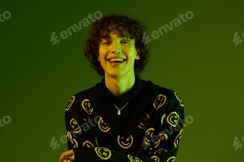 Preview: Man fashion and style accessories model with curly hair stylish sweater, hipster dance smile hands