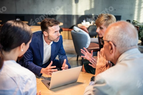 Preview: Serious disscussion about project during business meeting in cafe
