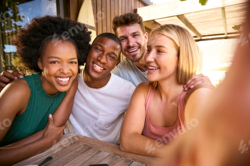Preview: POV Shot Of Multi-Cultural Friends Posing For Selfie On Mobile Phone Outdoors At Home