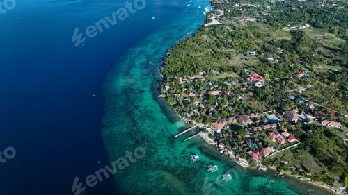 Preview: Aerial view of a coastal village with turquoise waters in Cebu, Philippines
