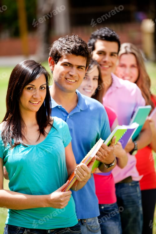 Preview: Group Of Students With Notebooks Smiling Outdoors