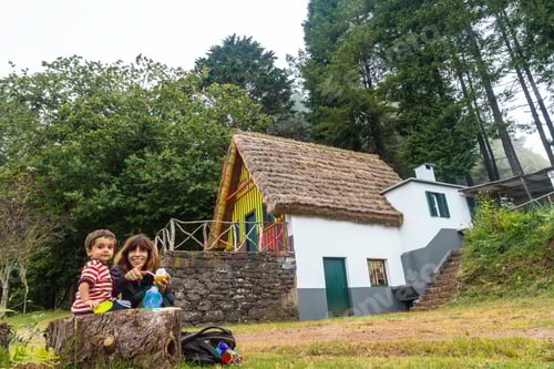 Preview: A family in the traditional Madeiran house like those of Santana in the forest of Caldeirao Verde