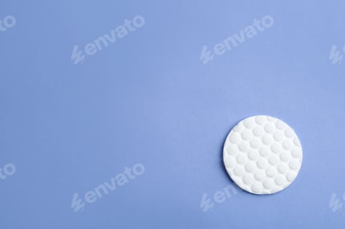 Preview: Cotton pad on color background, top view. Space for text