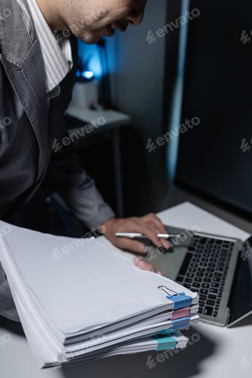 Preview: An entrepreneur sits alone in his company's private office, Notes are recorded on the computer becau