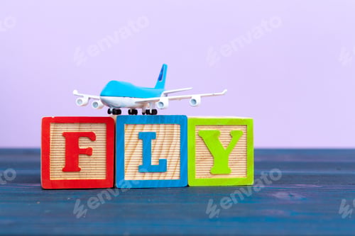 Preview: cube wooden block with alphabet building the word fly