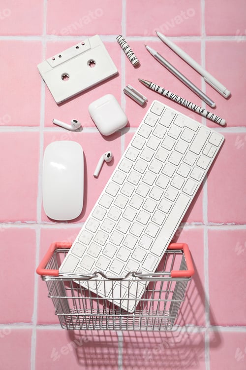 Preview: Computer keyboard with mouse and cassette on a pink background
