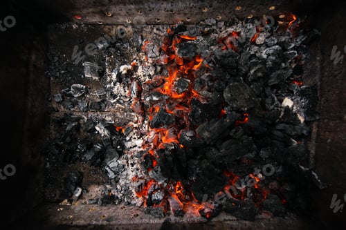 Preview: Burning coals. Decaying charcoal. Backround with charcoal.