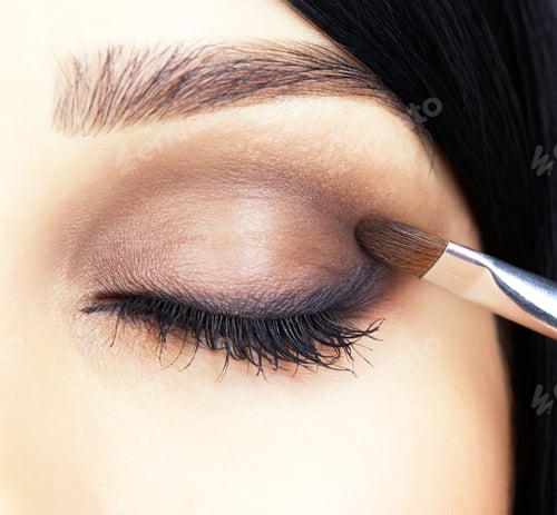 Preview: Close-Up Shot Of Woman Face And Makeup Brush Applying Mascara Make-Up On Eye Lashes