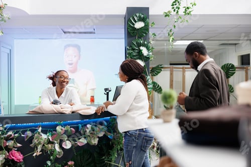 Preview: Customer chatting with cashier, buying clothes at checkout counter