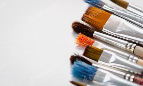 Preview: Art brushes on white background, paintbrushes on blank paper copy space