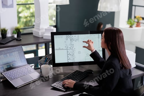 Preview: Woman working in real estate drafting software