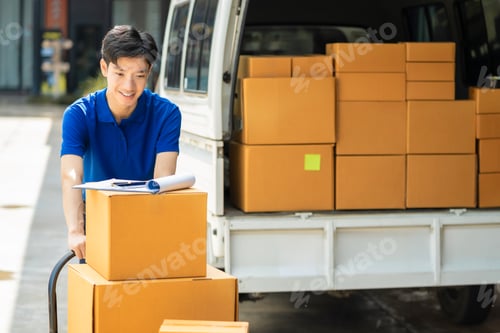 Preview: Asian delivery man work in truck for checking the product in the truck, concept ecommerce.
