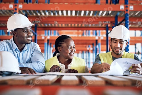 Preview: Shot of a group of builders having a meeting at a construction site