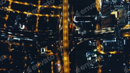 Preview: Top down night city traffic highway at lantern light with cityscape aerial view. Twilight illuminate