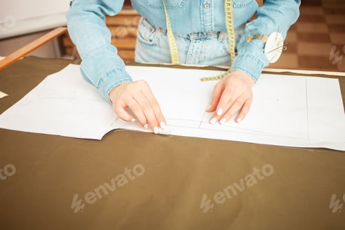 Preview: Seamstresses make sketch, pattern on fabric. Atelier, tailoring of individual clothes, small