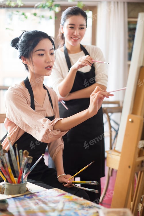 Preview: Young women painting in studio