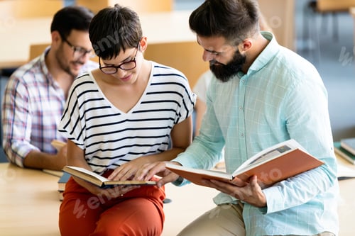 Preview: Group of college students working together in the school