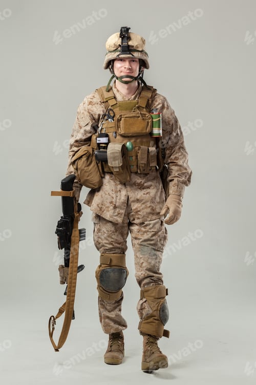 Preview: Soldier stands ready with equipment in military uniform during training session