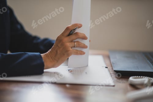 Preview: Closeup view of businesswoman or accountant working with documents