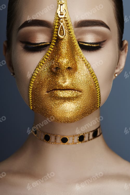 Preview: Creative grim makeup face of girl Golden color zipper clothing on skin. Fashion beauty creative