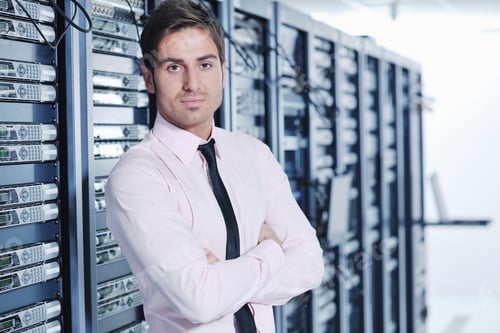 Preview: Young Handsome Business Man Engeneer In Datacenter Server Room