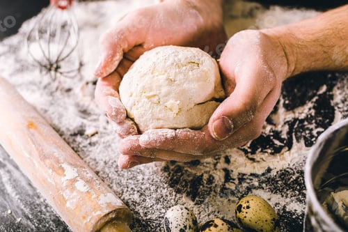 Preview: Hands kneading a dough