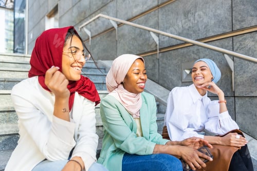 Preview: Beautiful muslim girl wearing hijab bonding outdoors