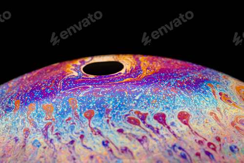 Preview: Multicolored abstract chaotic pattern inside of the soap bubble, closeup