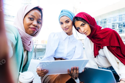 Preview: Beautiful muslim girl wearing hijab bonding outdoors