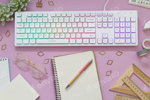 Preview: Flat lay composition with modern RGB keyboard on pink background