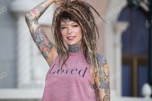 Preview: Beautiful hippie woman with tattoos and dreadlocks