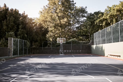 Preview: Empty still life of a basketball court on a sunny day with white marking and a hoop and net