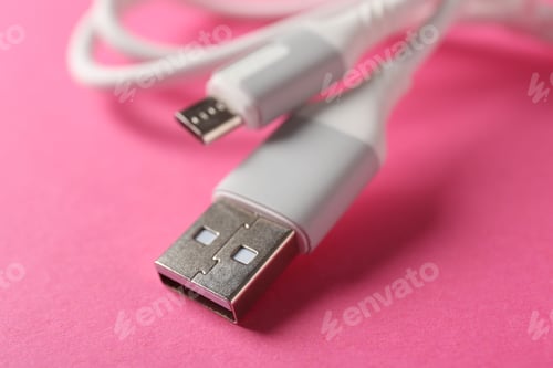 Preview: USB charge cable on pink background, closeup