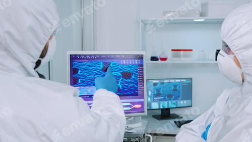Preview: Coworkers in coverall discussing about virus evolution