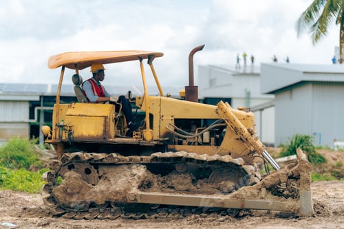 Preview: Black people worker in helmet on site construction, Excavator bulldozer male worker