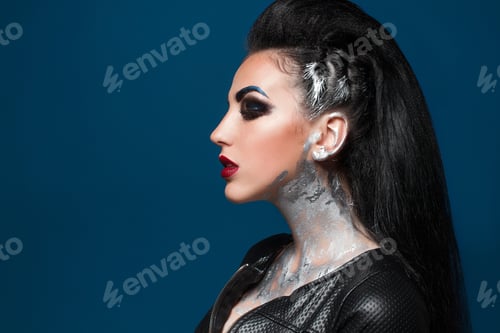 Preview: Girl With Creative Make-Up On A Blue Background