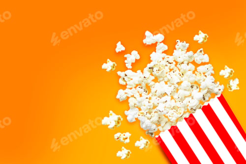 Preview: Paper cup with popcorn on yellow background - Clipping path