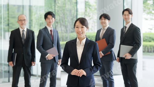 Preview: Asian business woman standing with a smile