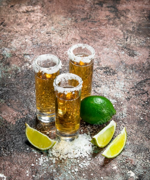 Preview: Tequila in a shot glass of salt and lime slices.