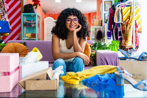 Preview: Beautiful young hispanic woman managing her home e-commerce business from home