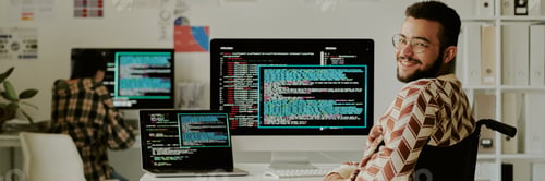 Preview: Header with Smiling Programmer at Work