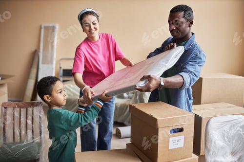 Preview: Young African American family of three holding wrapped painting