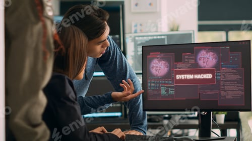 Preview: Asian software programer having system crash hacking problem with security breach