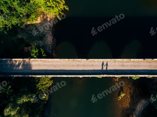 Preview: Shadows of two people holding hands on the bridge over the Crnojevica river